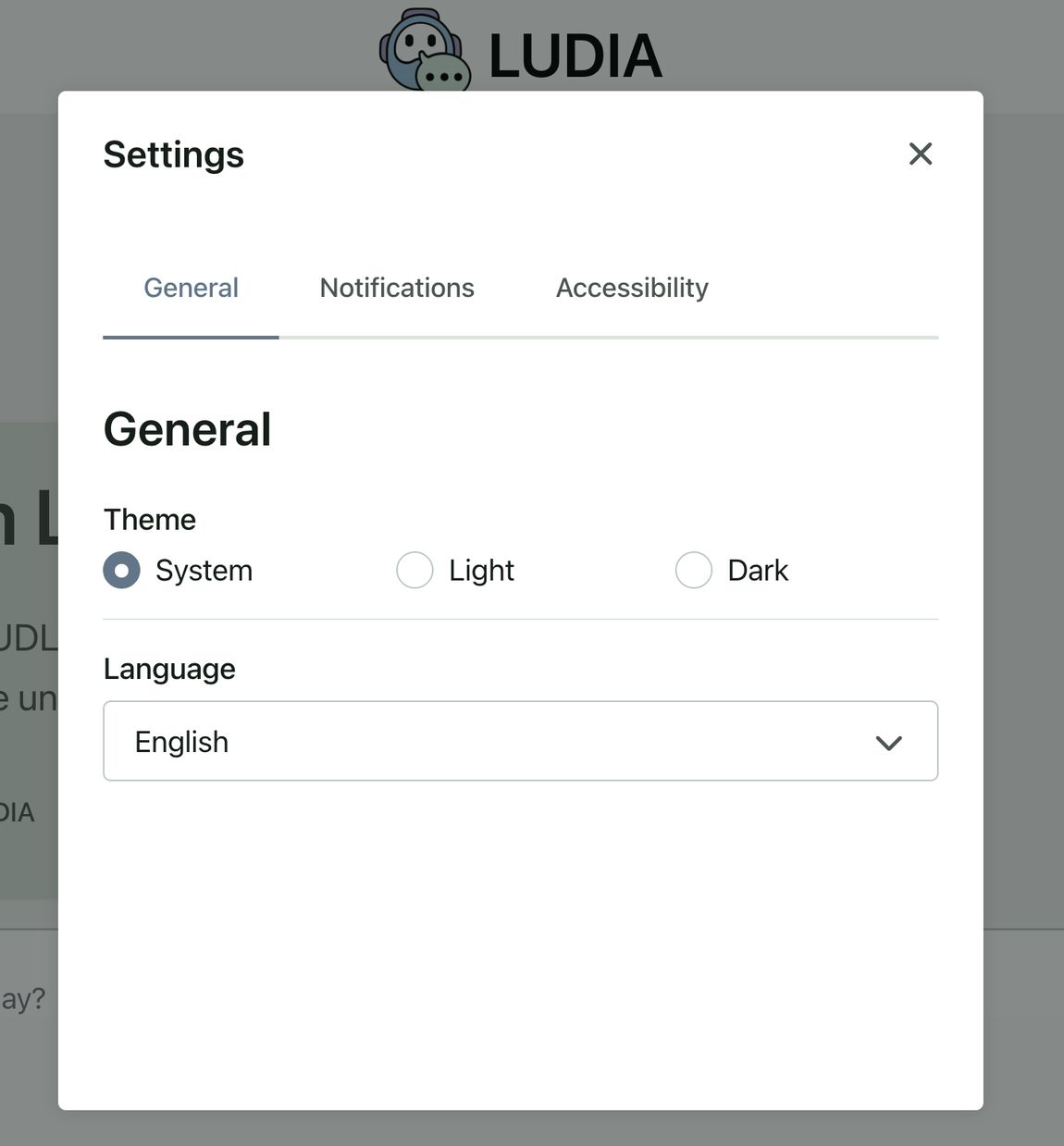 The Settings window with the General tab selected. Under Theme, System, Light, and Dark are shown with System selected. Below, the Language menu is set to English.